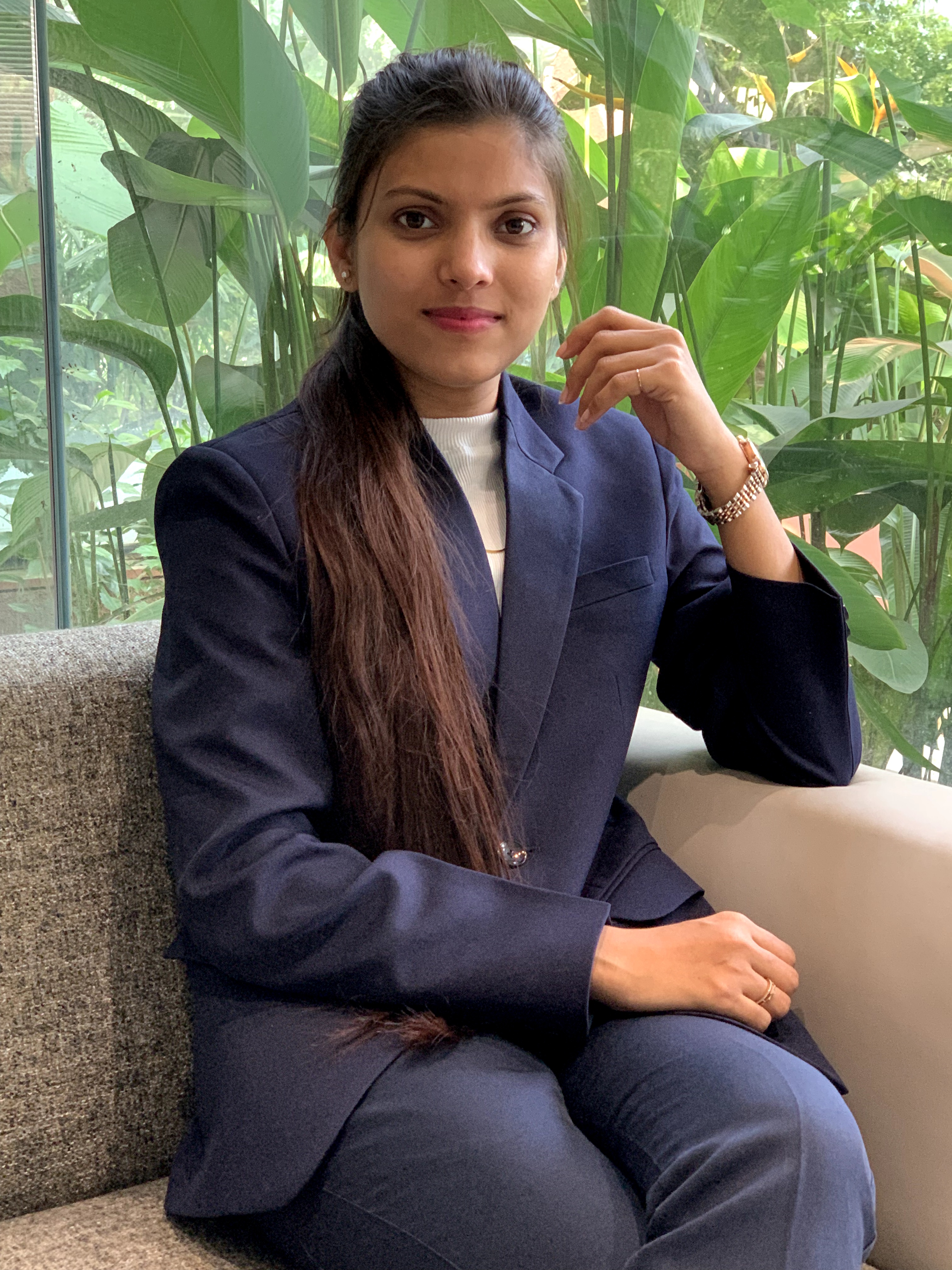 Kumud Waykole working at a multi-monitor development setup